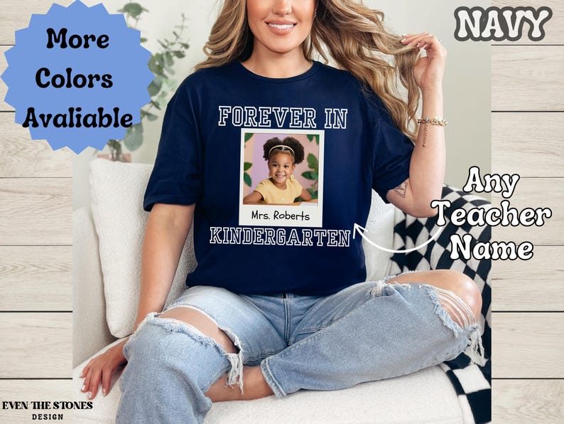 May include: Navy blue t-shirt with the words "FOREVER IN KINDERGARTEN" and a photo of a child. The shirt also has the text "Any Teacher Name" and "More Colors Available".