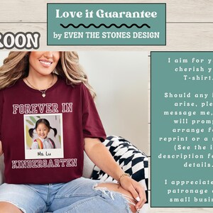 May include: Maroon t-shirt with the words "FOREVER IN KINDERGARTEN" in white block letters. A photo of a young girl is in the center. The text "Ms. Lu" is below the photo. The shirt has a crew neck.