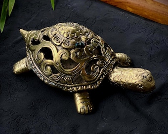 Handmade bronze turtle figurine for spiritual balance and interior harmony with a symbolic design and openwork shell for home or office deco