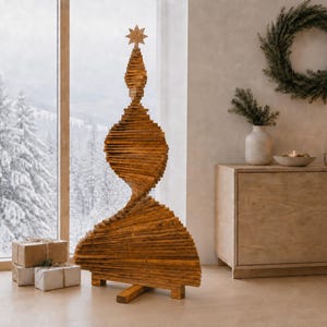 May include: A tall, sculptural Christmas tree made of stacked, horizontal wooden slats in a natural brown finish. The structure features a spiraling, tapered design that narrows toward the top, topped with a small, five-pointed wooden star ornament.