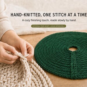 May include: A round, dark green hand-knitted tree skirt with a central opening and a slit. The text reads: HAND-KNITTED, ONE STITCH AT A TIME. A cozy finishing touch, made slowly by hand. OPTIONAL TREE SKIRT &bull; SOLD SEPARATELY.