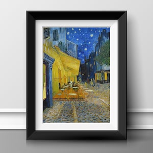 May include: Framed print of Van Gogh's "Cafe Terrace at Night." The artwork depicts a nighttime street scene with a yellow cafe, cobblestone street, and a starry blue sky. The black frame adds a classic touch to the art.
