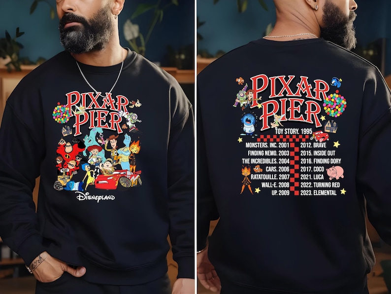 May include: Black sweatshirt with a graphic of Pixar characters and the text "Pixar Pier Disneyland" on the front. The back of the sweatshirt features the text "Pixar Pier" with a list of Pixar movies and their release years.
