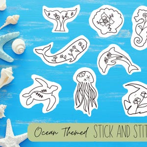 May include: A collection of ocean-themed stick and stitch designs in black and white, including a whale tail, seashell, seahorse, whale, dolphin, turtle, jellyfish, and fish. The designs are on a blue background with starfish and seashells.