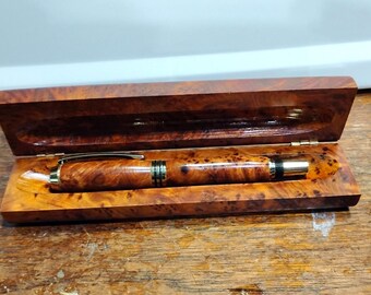 Tycoon Fountian pen with a Gold Color Finish and a Thuya Burl body and case