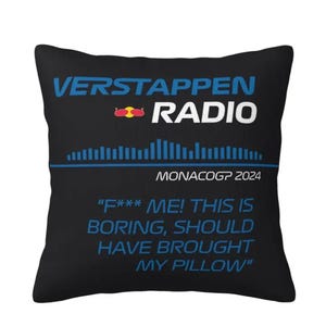 May include: Black square pillow with the text "VERSTAPPEN RADIO" in blue and white. Below the text is a graphic equalizer design and the text "MONACOGP 2024". The pillow also has the text "F*** ME! THIS IS BORING, SHOULD HAVE BROUGHT MY PILLOW".
