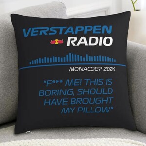May include: Black square pillow with the text "VERSTAPPEN RADIO" in white and blue. Below the text is a blue graphic and the words "MONACOGP 2024". The pillow has the quote "F*** ME! THIS IS BORING, SHOULD HAVE BROUGHT MY PILLOW".