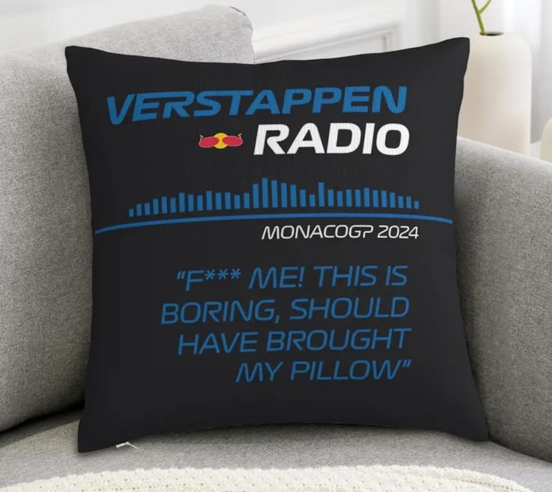 May include: Black square pillow with the text "VERSTAPPEN RADIO" in white and blue. Below the text is a blue graphic and the words "MONACOGP 2024". The pillow has the quote "F*** ME! THIS IS BORING, SHOULD HAVE BROUGHT MY PILLOW".