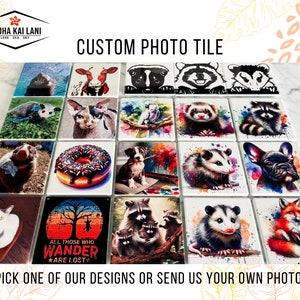 May include: A collection of 16 custom photo tiles featuring various animal and nature designs. The tiles are square and have a white background. Some of the designs include a raccoon, a fox, a donut, a cat, a dog, a ferret, a possum, and a bird. The tiles are perfect for adding a personal touch to any space.