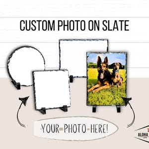 May include: Three slate photo frames with different shapes and sizes. The frames are blank, except for one that has a photo of two dogs. The text "YOUR PHOTO HERE!" is written on a white surfboard.