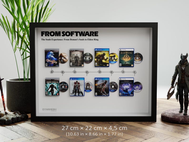 May include: Framed artwork featuring video game covers and discs from the "Souls Experience" series, including "Demon's Souls" and "Elden Ring." The black frame measures 10.63 x 8.66 x 1.77 inches. The text "FROM SOFTWARE" is at the top.