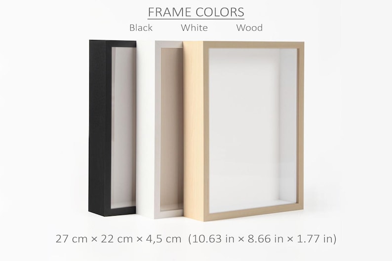 May include: Three shadow box frames in black, white, and wood colors. The frames are rectangular with a recessed interior. The dimensions are 10.63 inches x 8.66 inches x 1.77 inches. The text "FRAME COLORS" is at the top.