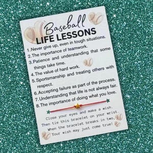 May include: A white card with the words "Baseball Life Lessons" and baseball graphics. The card lists eight life lessons and instructions for a wish bracelet. A red string bracelet with a gold star is attached.