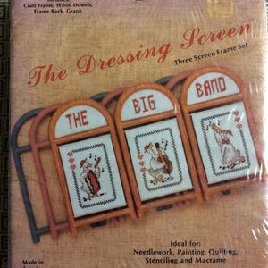May include: A craft kit for a three-screen frame set. The packaging features the text "The Dressing Screen" and illustrations of a band of ducks. Includes craft frame, wood dowels, frame back, and graph. Made in America.