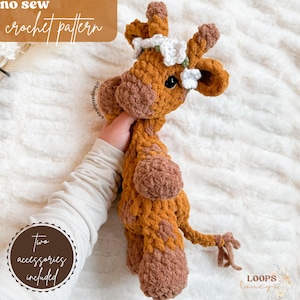 May include: A crocheted giraffe toy with a brown and tan color scheme. The giraffe is wearing a white flower crown and has a long tail. The text "no sew crochet pattern" is visible at the top of the image. The text "two accessories included" is visible in a circle at the bottom left of the image.