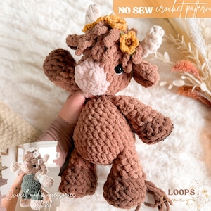 May include: A handmade brown crochet cow plushie with a pink nose, yellow flower accents, and white horns. The text "NO SEW crochet pattern" is visible. The plushie is a soft, cuddly toy.