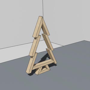 Puede incluir: Un adorno de árbol de Navidad de madera hecho de piezas de madera apiladas. El árbol es de color marrón claro y tiene un diseño simple.