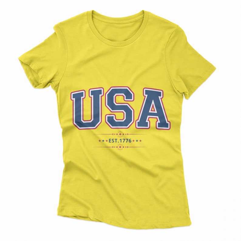 May include: Yellow t-shirt with a navy blue and white USA graphic and the text "EST. 1776" in red.