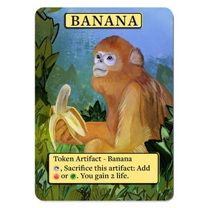 May include: A trading card featuring a golden monkey holding a peeled banana. The card has the word "BANANA" at the top and text at the bottom that reads "Token Artifact - Banana". The background is a blue sky and green foliage.