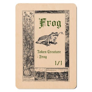 May include: A vintage-style card featuring a detailed illustration of a frog with its tongue extended. The word "Frog" is written in ornate green lettering above the frog. The card also includes the text "Token Creature - Frog" and "1/1".