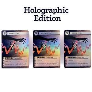 May include: Three holographic trading cards with the text "Hedge Fund" and "Operation: Transaction." The cards feature a hand graphic and a red and orange wave pattern. The text "Holographic Edition" is at the top.