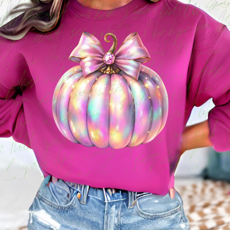 May include: A pink iridescent pumpkin with a large pink bow and a gold stem. The pumpkin has a sparkly, pearlescent finish.