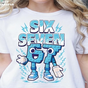 May include: White t-shirt featuring the words "SIX SEVEN" in a blue, blocky font with a lightning bolt design. The numbers "6" and "7" are personified with arms, legs, and cartoon faces, and are also blue.