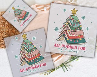 May include: DTF transfers featuring a Christmas tree design made of books, adorned with string lights and a star. The text "ALL BOOKED FOR Christmas" is displayed. The words "READY TO PRESS" and "DTF TRANSFERS" are also visible.