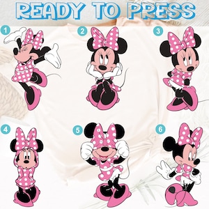 May include: A white t-shirt with six Minnie Mouse designs in various poses. Each Minnie Mouse is wearing a pink dress with white polka dots and a matching bow. The text "READY TO PRESS" is at the top in light blue.
