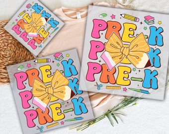 May include: A set of three iron-on transfers featuring a colorful pre-k design with a bow made of a pencil. The design includes the text "PRE-K" in a variety of colors and fonts. The transfers are ready to press onto clothing or other fabric items.