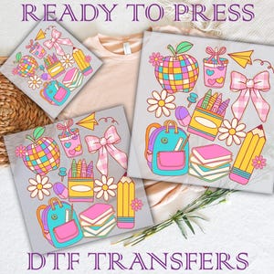 May include: The image showcases DTF transfers with a school theme. The designs feature colorful illustrations of apples, backpacks, pencils, books, and bows. The text "READY TO PRESS" and "DTF TRANSFERS" are visible.