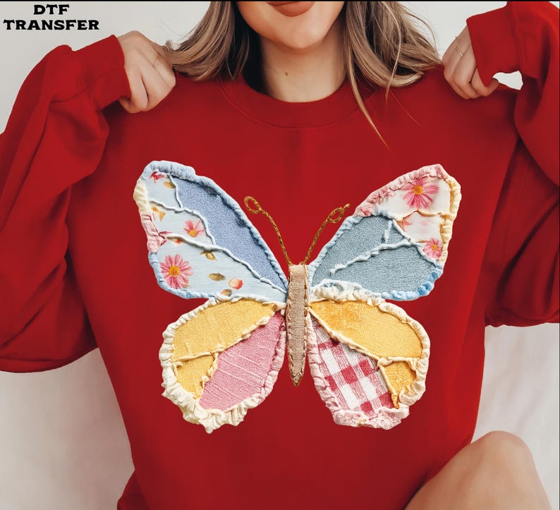 May include: A red sweatshirt featuring a large, colorful butterfly applique. The butterfly wings are patchwork, with floral, denim, and gingham patterns. The text "DTF TRANSFER" is in the upper left corner.
