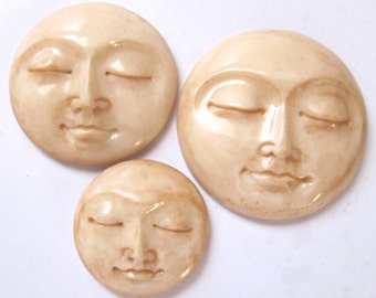 MS Carved Bone Tea Stained Round Moon Faces Closed Eyes Fair Trade Bali