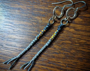 One of a kind handmade long beaded earrings with fringe tassel ends.