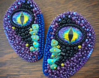 Bead embroidered dragon eye earrings.
