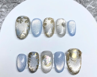 Blå Cat Eye-pressnaglar: Guldfärgade blommiga glitter, återanvändbart nagelset