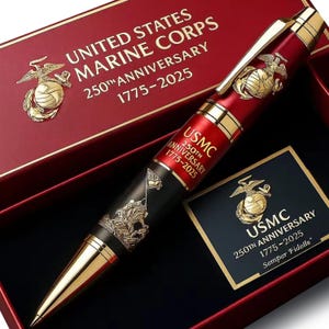 May include: A commemorative pen for the United States Marine Corps' 250th Anniversary. The pen features a red and black barrel with gold accents, the USMC emblem, and the text "USMC 250th Anniversary 1775-2025". The pen is presented in a red box.