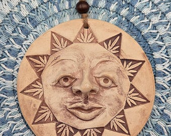 Hand-sculpted Ceramic Sunface Wall Hanging, Earthy Iron Oxide Glaze, Mellow Smile (5.5" Wide)