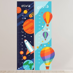 May include: Two colorful growth charts for kids, one with a space theme and the other with a hot air balloon theme. Both charts feature the name "Olivia" and measure from 20 to 160 centimeters.