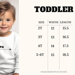 May include: A size chart for toddler clothing with measurements in inches. The chart shows the width and length of clothing in sizes 2T, 3T, 4T, and 5-6T.