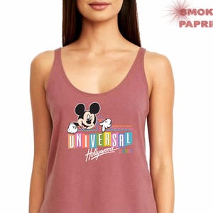 May include: A maroon tank top with a rainbow graphic of Mickey Mouse and the text "Universal Hollywood" on the front.