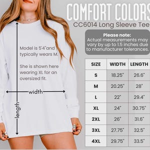 May include: White Comfort Colors CC6014 long sleeve tee. The image includes a size chart with measurements in inches for width and length, ranging from size S to 4XL. The model is 5'4" and typically wears M, shown wearing XL for an oversized fit.