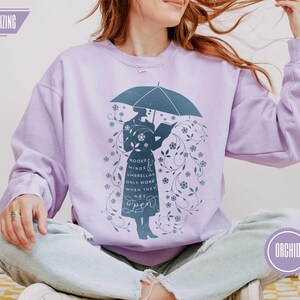 ORCHID (muted lavender purple) sweatshirt with bookish silhouette and floral detail, feminine cozy style for readers, teachers, and book lovers, winter teacher outfit