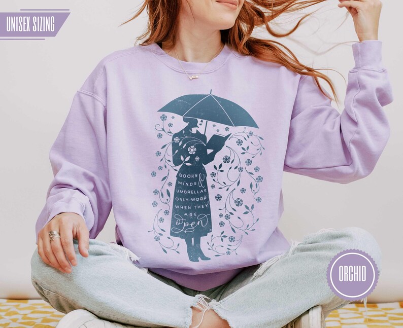 ORCHID (muted lavender purple) sweatshirt with bookish silhouette and floral detail, feminine cozy style for readers, teachers, and book lovers, winter teacher outfit