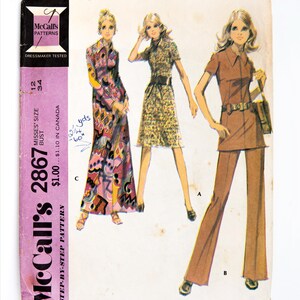 May include: Vintage McCall's sewing pattern for a dress or tunic and pants. The pattern is for misses' sizes 12 and 34. The pattern includes instructions for making a long dress with a floral print, a short dress with a leopard print, and a tunic and pants set in a solid brown color. The pattern is from the 1970s.