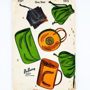 May include: Vintage DuBarry sewing pattern featuring illustrations of various bags and pouches. The pattern includes a black clutch, green drawstring bags, and an orange mug-shaped bag. The pattern is marked "Made in Canada" and priced at 15 cents.