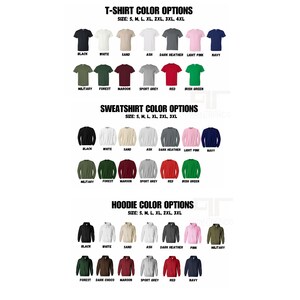May include: Image displaying colour options for t-shirts, sweatshirts, and hoodies. T-shirt colours include black, white, sand, ash, dark heather, light pink, and navy. Sweatshirt and hoodie options are also shown, with various colours and sizes.