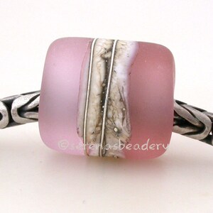 May include: A pink glass bead with a white and brown marbled design. The bead is on a silver chain.