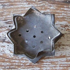 Sunflower (or sun) cookie cutter showing cutting edge which is out of alignment and a bit loose.