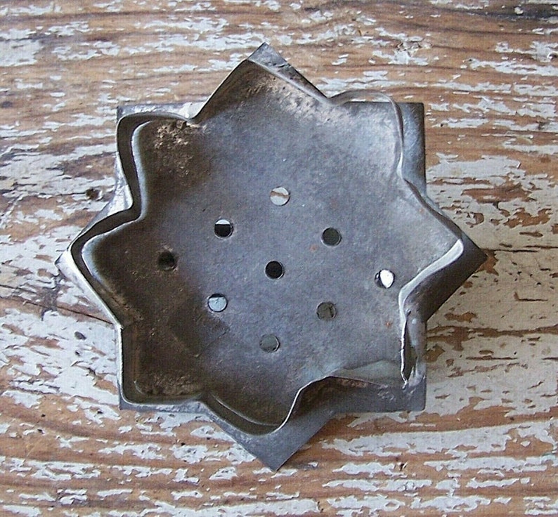 Sunflower (or sun) cookie cutter showing cutting edge which is out of alignment and a bit loose.